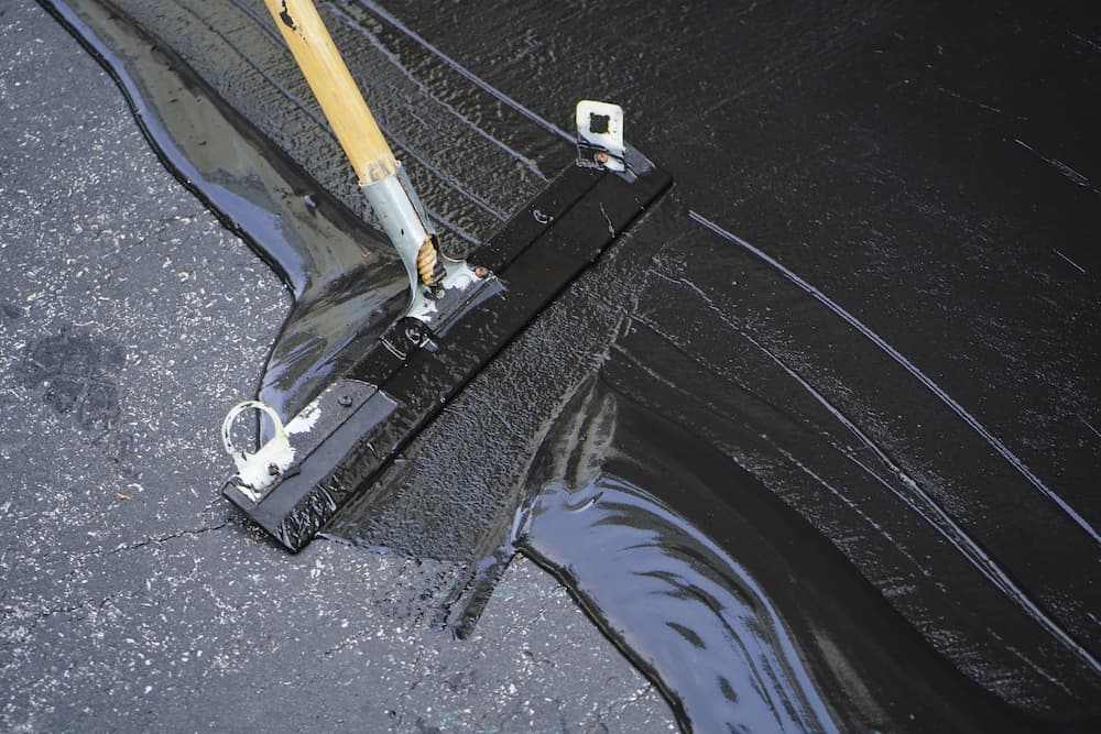 The Role of Sealcoating in Extending the Lifespan of Asphalt Parking Lots